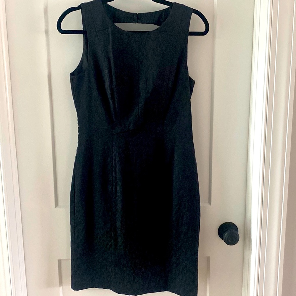 Fitted black pencil dress with keyhole back. Satin with animal pattern sz 8